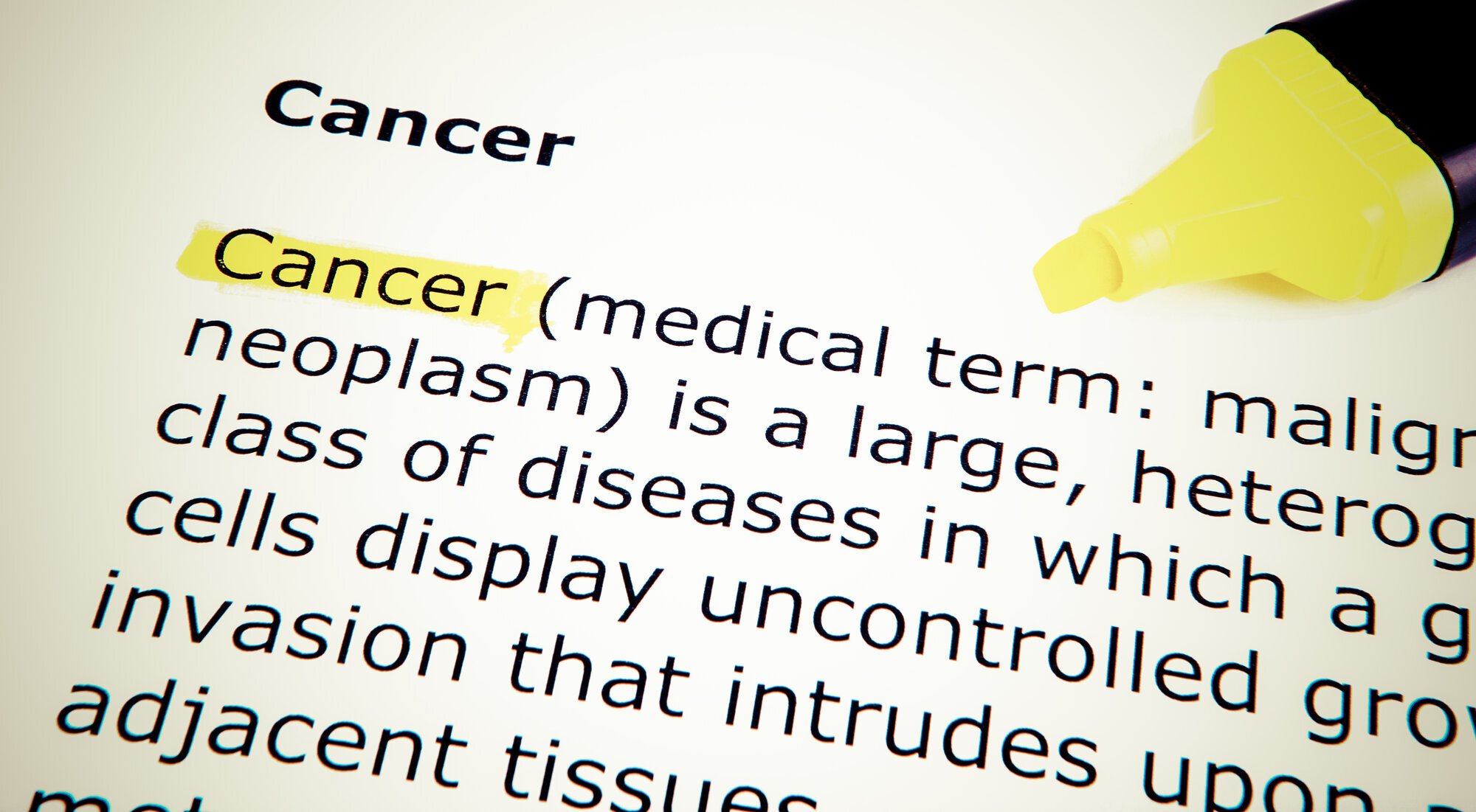 kreft, definisjon Bildet viser en bokside med definisjon av cancer.